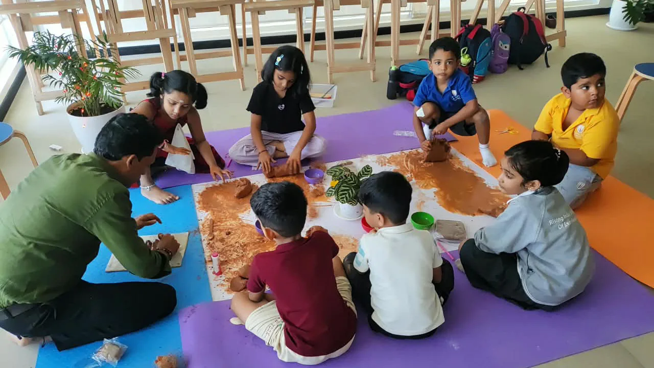 Children doing a floor art activity